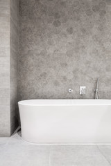 Naklejka na ściany i meble White bathtub and hexagonal tiles