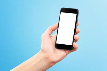 Mockup of male hand holding black cellphone isolated at blue background.