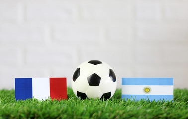 ball with Argentina VS France flag match on Green grass football 2018
