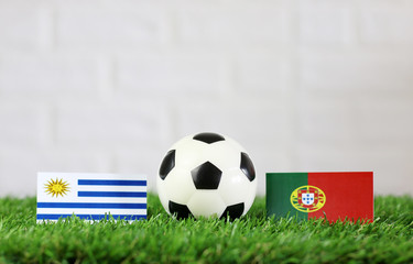 ball with Uruguay VS Portugal flag match on Green grass football 2018
