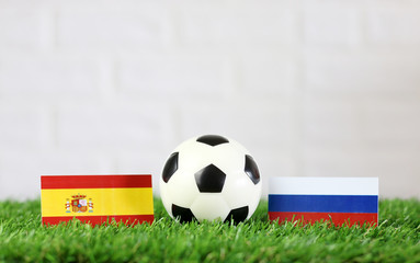 ball with Russia VS Spain flag match on Green grass football 2018