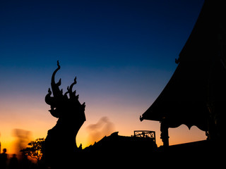 Twilight of Silhouette Naga Heads on The Hill of Wat Sirintorn