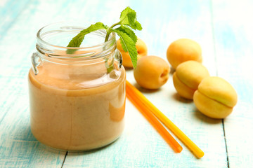 Apricot smoothies in a glass jar