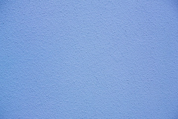 Photo of the cold blue colored rough stucco wall texture