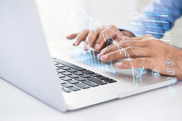 Businessman using computer searching for digital data of stock for investment