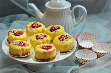 Cheesecake cupcake with strawberries sprinkled with nuts