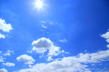 Naklejka na ściany i meble Blue sky with sun