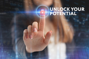 The concept of business, technology, the Internet and the network. A young entrepreneur working on a virtual screen of the future and sees the inscription: Unlock your potential