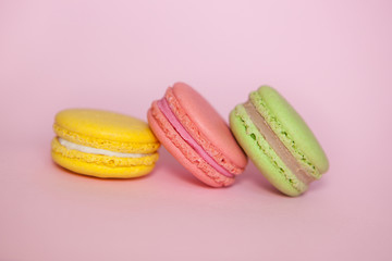 Macaroon on pastel pink background, sweet food with beautiful colors