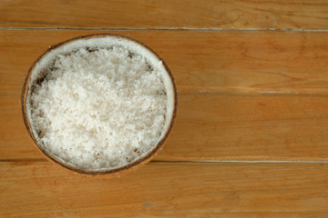 Fototapeta na wymiar coconut powder on wood background