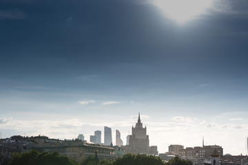 Fototapeta na wymiar Moscow city historical skyline panorama with roofs and sun.