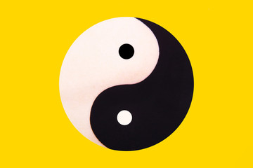 Ying yang symbol of harmony and balance on the yellow