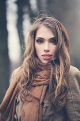 Young woman with brown hair outdoors