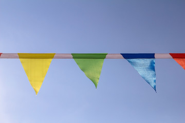 Colorful triangular flags of decorated celebrate outdoor party sunlight