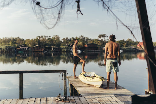 Men Enjoying Vacation on River