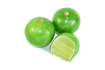 Two lemons and half  on a white background.