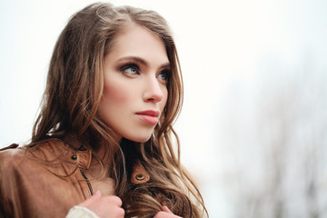 Portrait of young woman outdoors. Perfect model face closeup