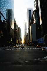 59th street in New York with the sun coming down the middle of the road during Manhattanhenge