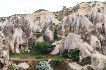 Fototapeta na wymiar beautiful landscape with famous caves and rock formations in goreme national park, cappadocia, turkey
