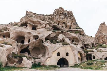 caves in limestone at famous goreme national park, cappadocia, turkey