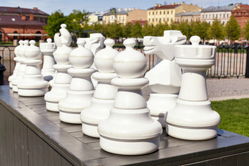 Large outdoor chess in the park in summer