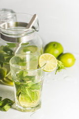 uice with lime and mint on white background