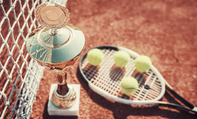 Tennis ball with racket on the tennis court. Sport, recreation concept