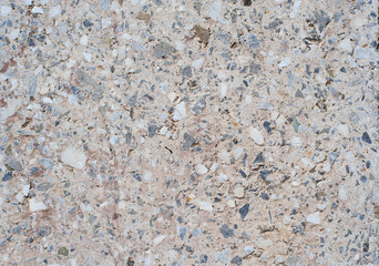 The texture background of a light granite tile interspersed with stone for design. Granite slab, marble texture