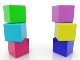 Two colorful poles of toy cubes on white