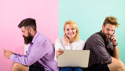 Company happy friends with mobile gadgets laptop. Men and woman have access to network from...