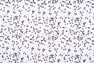 Abstract pattern with dark stains and dots on white background