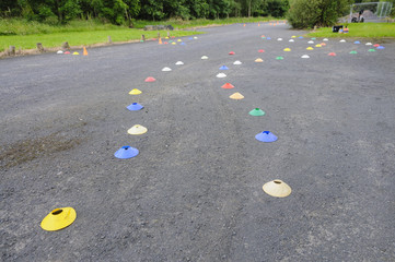 A marked off obstacle course on tarmac