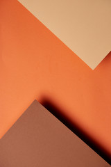 Paper sheets in brown and orange tones background