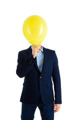 Businessman in suit with yellow air ballon instead of head , isolated on white.