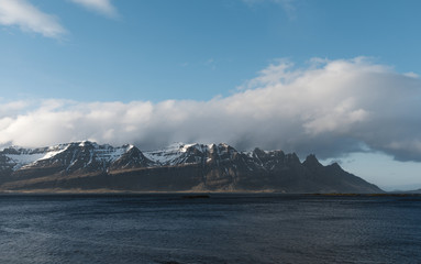 Mountain range by a fjord