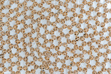 Natural abstract background with interconnected bamboo and white woolen cloth pattern