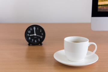 Coffee cup with clock on table, Coffee time concept.