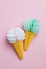 Paper ice cream cone decoration on a pastel pink background