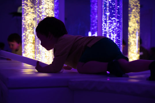 Young kid exploring snoezelen space