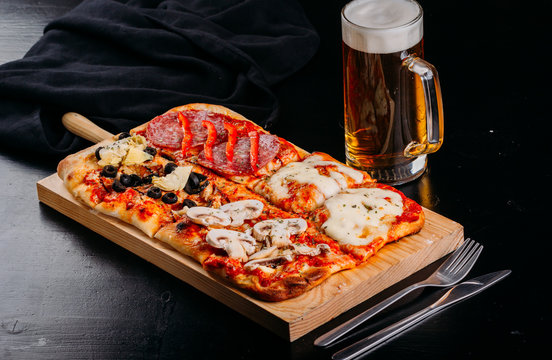 Bright pizza with vegetables on wooden board