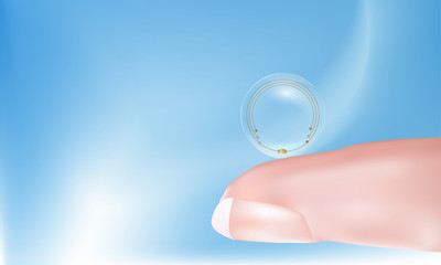 Finger holding a contact lens with high-tech chips. Technology of the future