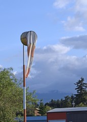 windsock indicating no wind with the Courtenay air park in the background 