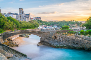 Sunset view of church Sainte-Eugenie and Rocher Du Basta island in Biarritz, France