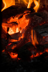 Crest of flame on burning wood in fireplace. Burning firewood in a Russian stove.