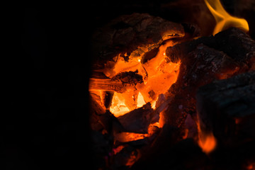 Crest of flame on burning wood in fireplace. Burning firewood in a Russian stove.