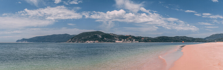 Fototapeta na wymiar The sandy Bico das Lulas Beach in Troia, Portugal