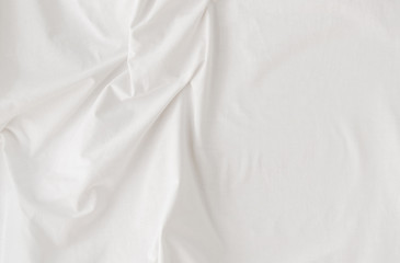 Fototapeta na wymiar clean white linen fabric with folds, background, soft daylight, top view, close up