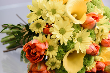 The bride's bouquet is yellow close. Flowers for the bride on the wedding day.