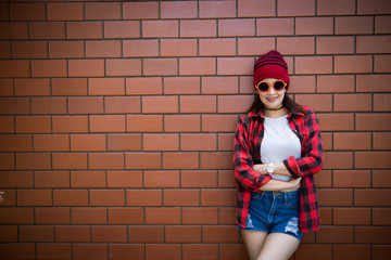 Portrait asian hipster girl on brick wall background,Lifestyle of thailand people