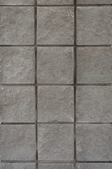 Closeup of gray stone tiles mosaic wall background